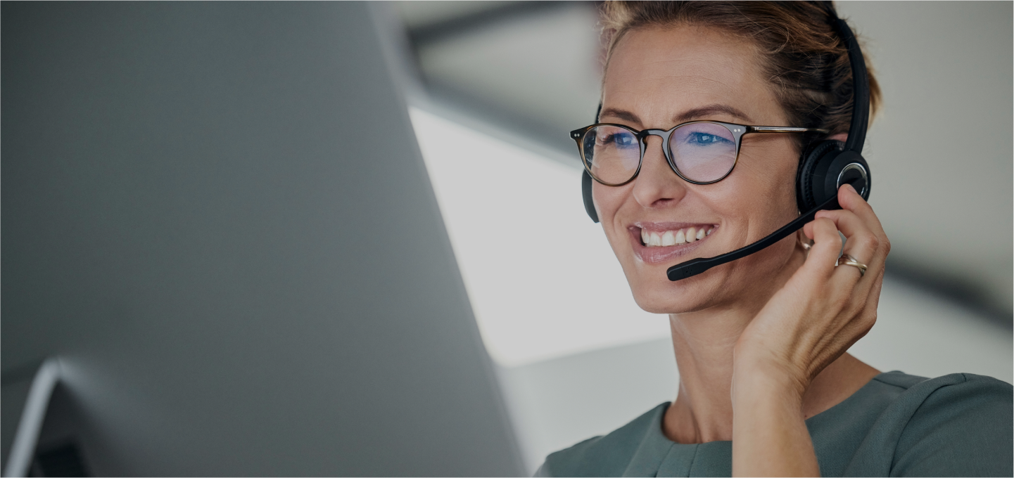 A woman doing tech support on the phone